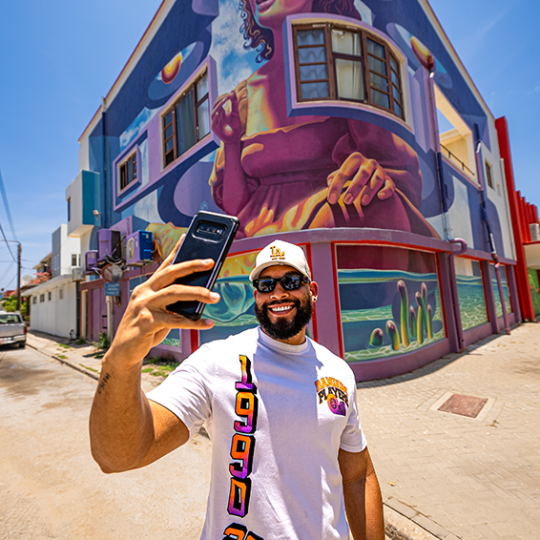 taking pictures during de palm tours jeep tour safari through san nicolas street art